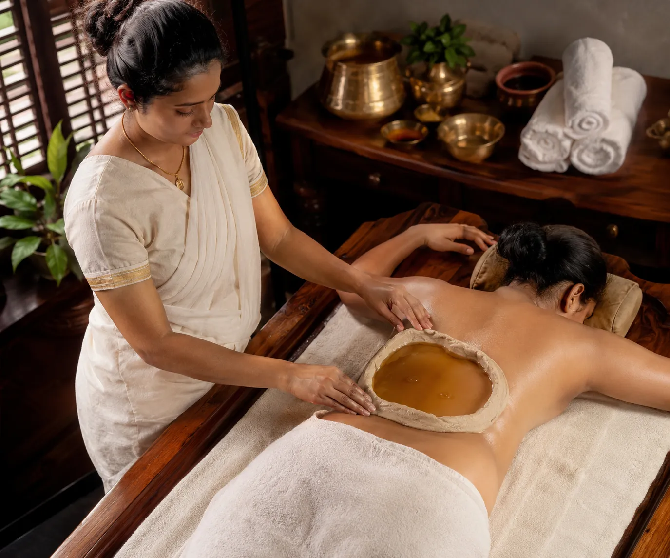 Kati Basti warm oil therapy for lower back